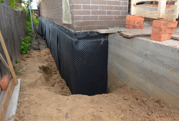 SJ Waterproofing Pros technician performing targeted Foundation Crack Repair assessment in Pennville, IN